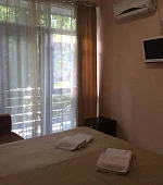 "Стандарт с балконом и боковым видом на море" 2х-3х-местный